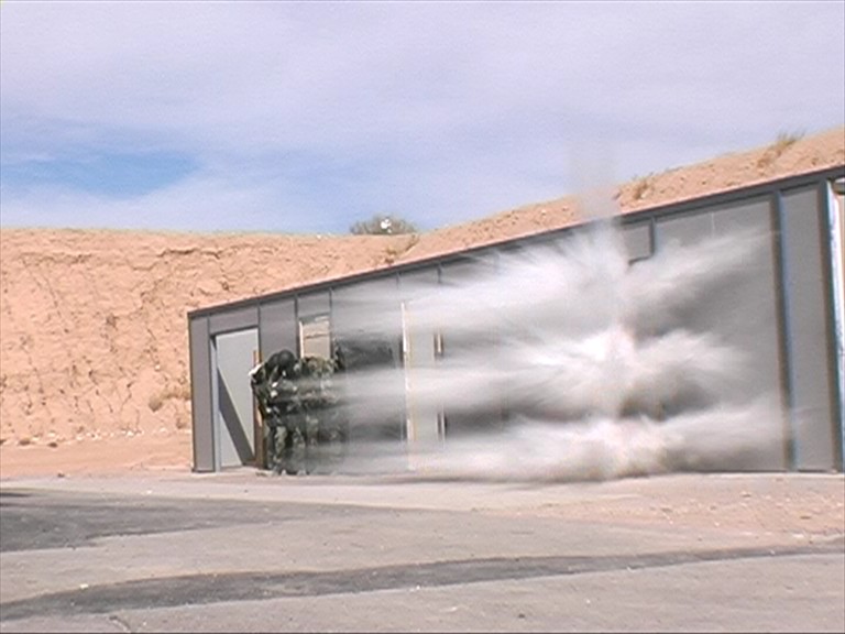 Breaching operators attacking a door with Alford Breachers Boot