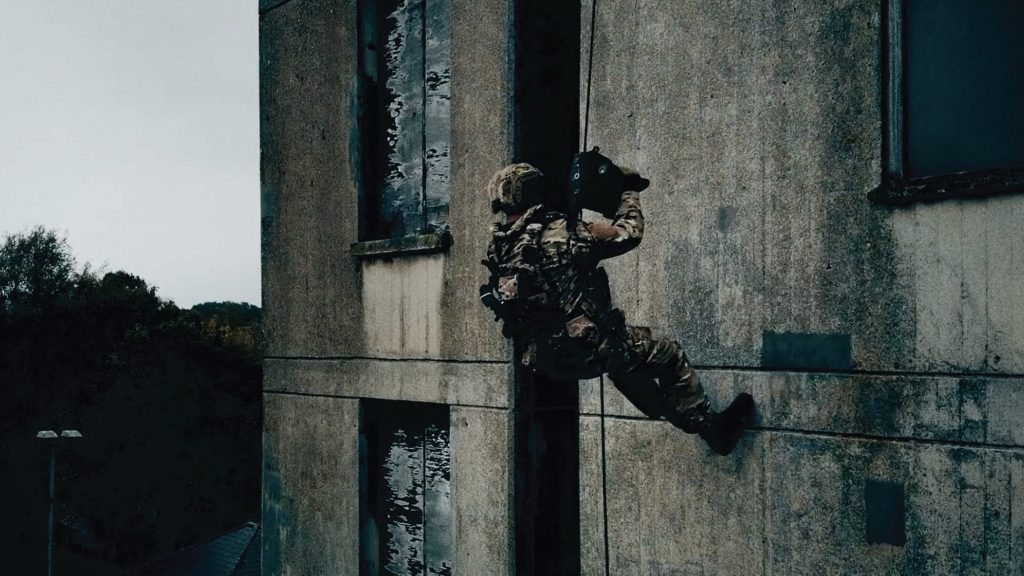 Operator ascending a building using Skylotec Powered Ascender