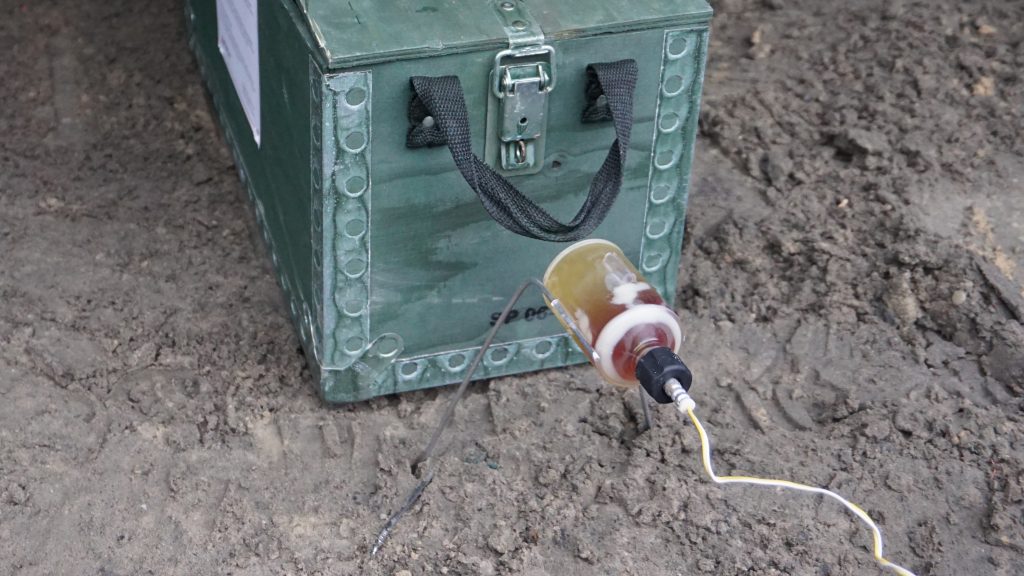 Alford's W-Etna IED disruption tool positioned against an IED target