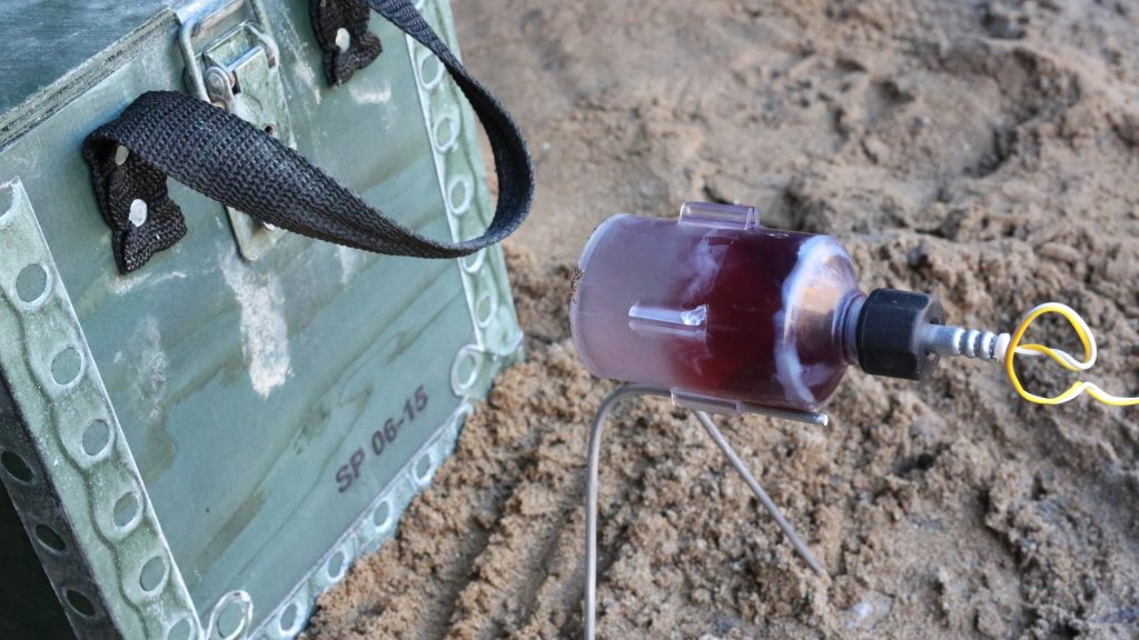 Alford's W-Etna IED disruption tool positioned against an IED target