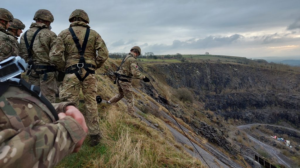 Military personnel engaged in fast ropes training at Broadmead Range